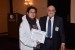 Dr. Nagib Callaos, General Chair, giving Dra. Lorena Chavarría-Báez the best paper award certificate of the session "Empleo de Tecnologías Avanzadas como Apoyo en los Procesos de Enseñanza y Aprendizaje II." The title of the awarded paper is "Sobre el Uso de Herramientas CASE para la Enseñanza de Bases de Datos."